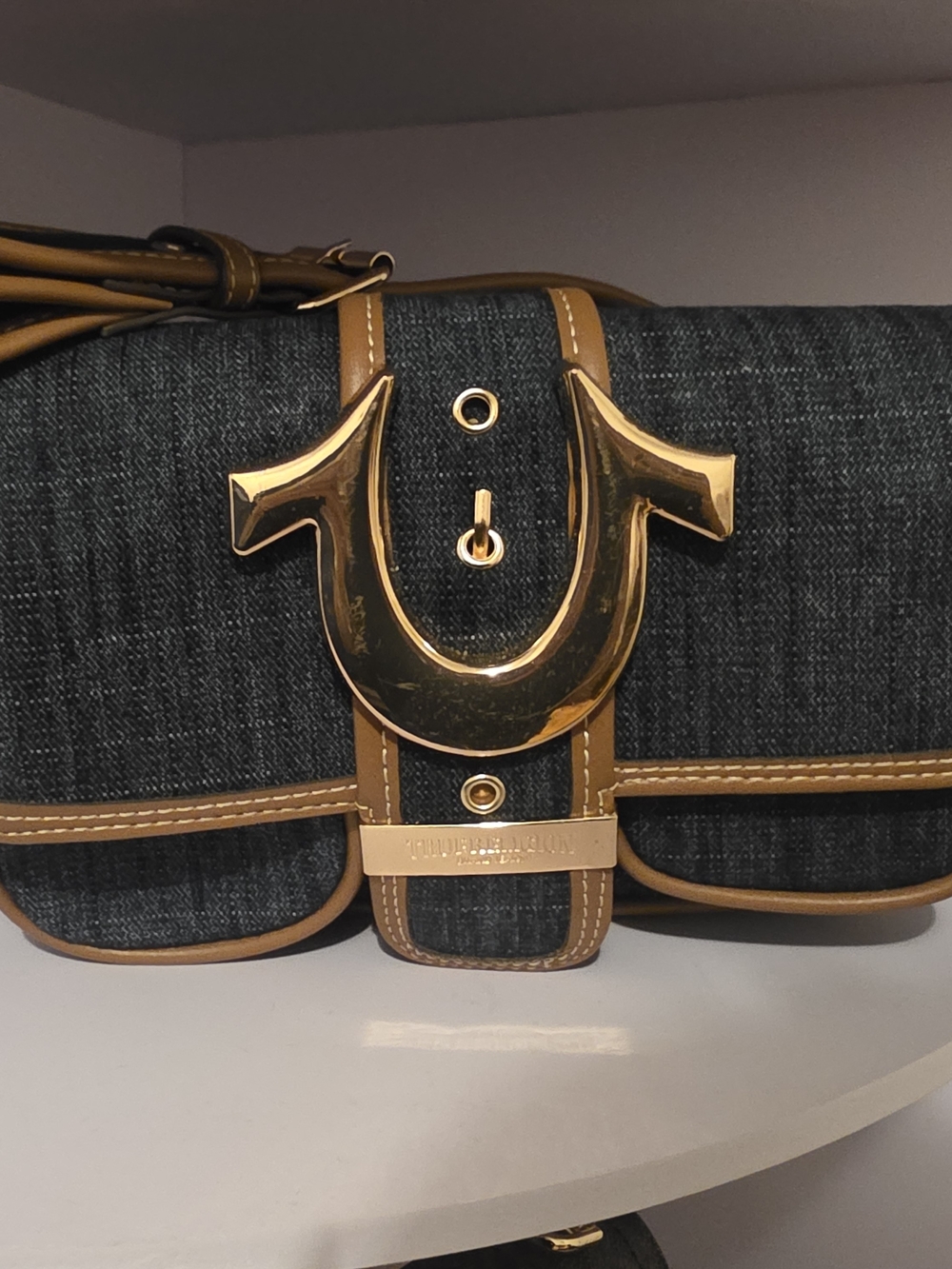 True Religion Dark Denim Shoulder Bag with Tan Trim and Gold Accent